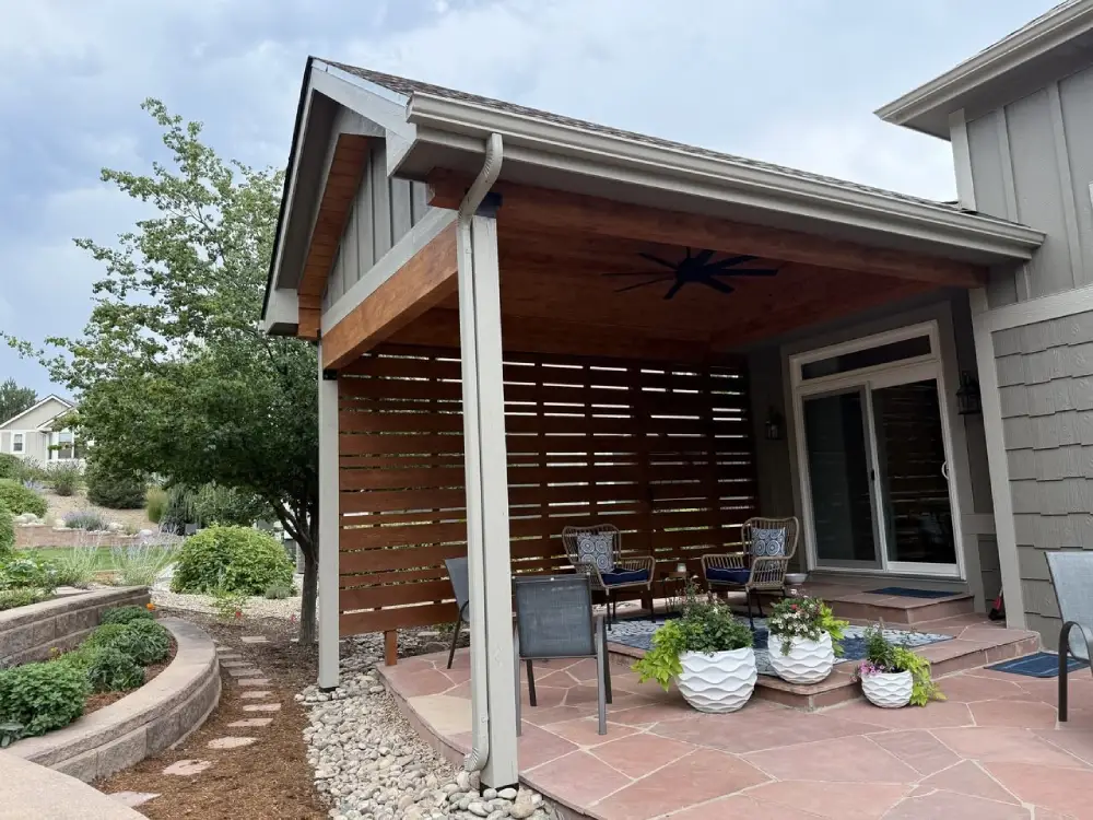 Outdoor patio cover with modern seating area and landscaped garden path