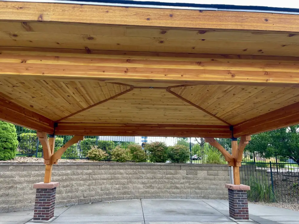Arvada home pavilion built with wood beams, railing, and durable roof design